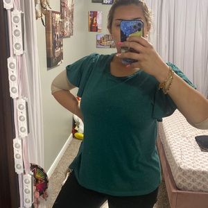 Emerald green top, very elegant, I bought it from Macy’s, made in Jordan